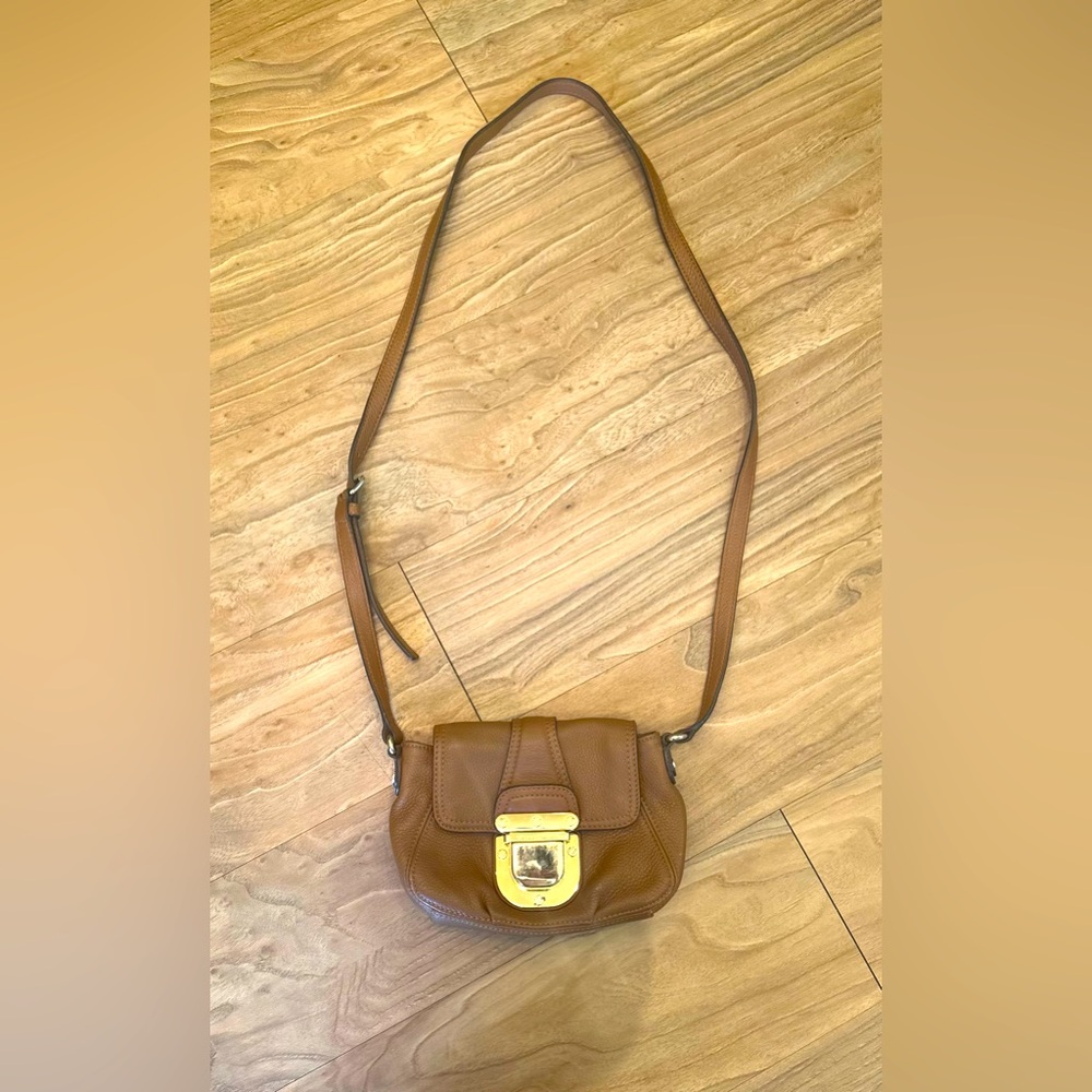 Michael Kors brown leather small purse/shoulder bag.